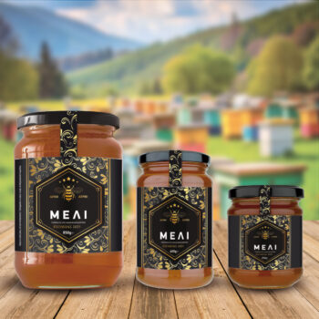 Ετικέτα μελιού σε τρεις διαστάσεις. Μαύρο φόντο και μοτίβα σε χρυσαφί χρώμα.